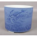 A Chinese painted underglaze blue porcelain brush pot, decorated with two Kylin, four character