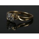 An 18ct gold diamond crossover ring. Size N. 3.66g.