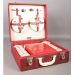 A Vintage Brexton picnic hamper set in case. Includes four cups and saucers, two Thermos flasks