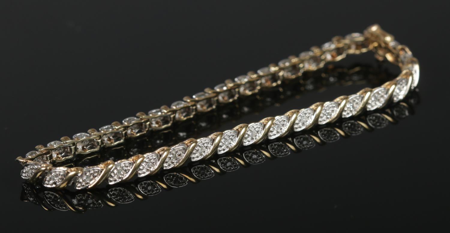 A 9ct gold diamond set bracelet. With 34 small illusion set diamonds. 19cm. 6.99g. - Image 2 of 2