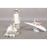 Three Lladro/Nao figures. 'Let's Fly away' No. 6665, 'Rabbit eating' No. 4772, to include Nao girl