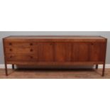 A mid century Wrighton rosewood sideboard with three drawers and bifold cupboard doors. Height 76.
