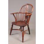 A 19th century part yew wood Windsor arm chair with crinoline stretcher. Metal repair to back of