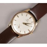 A gents 9ct gold Omega manual wristwatch on leather strap. Satin dial, baton markers and