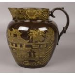 An early 19th century brown ware pottery jug printed in yellow with chinoiserie scene. 15.5cm.