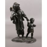 A Japanese spelter figure group of a mother and child. Marks to base. 22cm.