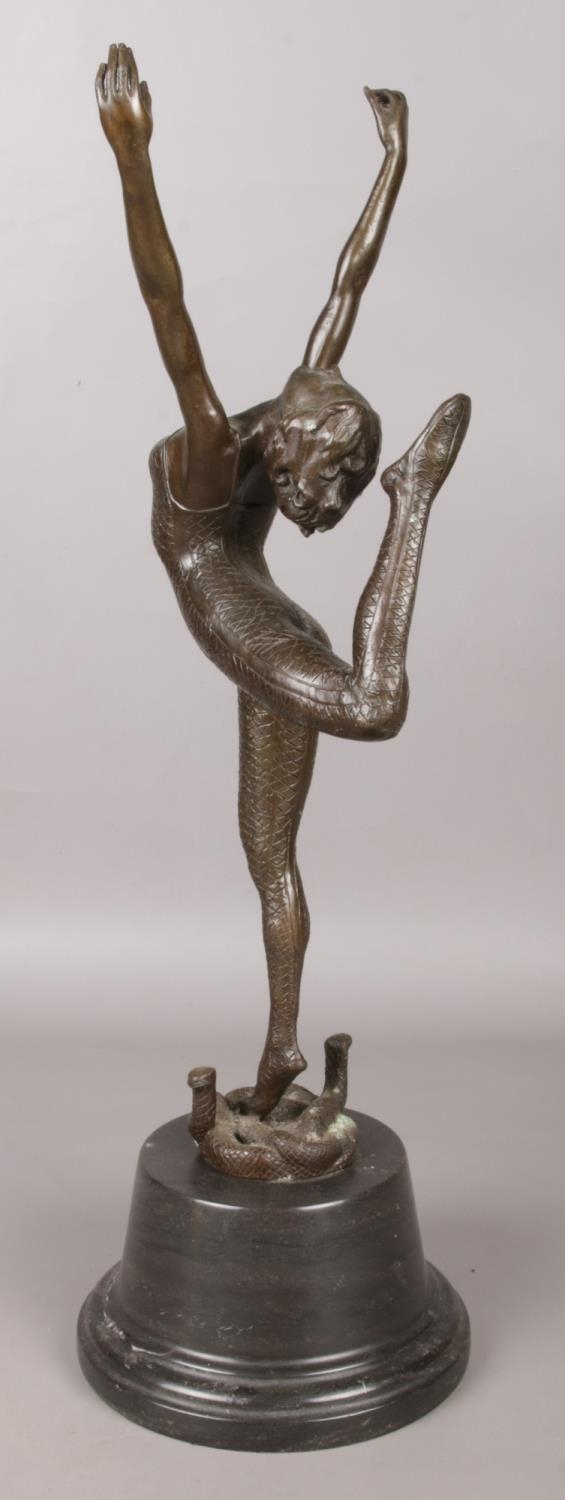 After Otto Poertzel, a bronze sculpture on marble base, modelled as a dancer standing on two snakes. - Image 2 of 2