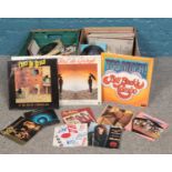 Two boxes of 45 rpm & LP vinyl records. Chris De Burgh, Billy Joel, Jon Bon Jovi, The Nolans, Bonnie