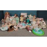 A large collection of mostly Ashton Drake porcelain dolls. 'Twinkle Twinkle Little Star', 'Too tired