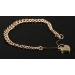 A 9ct Gold chain bracelet with 9ct Gold heart shaped padlock. Each link of the chain stamped.