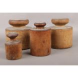 A set of four vintage turned pork pie moulds.