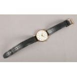 A vintage Gents Accurist mechanical wristwatch, with 9ct gold front and back and 21 jewel Swiss