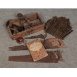 A box of vintage hand tools. Includes Spear and Jackson saw, drill bits, woodwork book etc.