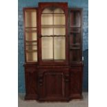 A Victorian mahogany breakfront bookcase, with glass front. Height: 214cm, Width: 132cm, Depth,