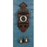 A mid century dutch Atlas mahogany wall clock, with twin weights and German FHS movement.