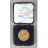 A Shakespeare medal, with portrait on one side, and birth and death dates to the reverse, cased in