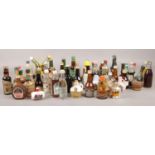 A collection of alcohol miniatures. Ouzo, Baileys, Smirnoff Vodka etc. a mixture of unsealed/
