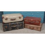 A collection of four vintage suitcases and travel trunks. To include a large black leather
