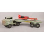 A large Tri-ang truck and trailer with rocket launcher. Length: 62cm. Play worn.