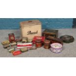 A large vintage bread bin, together with a collection of tins.