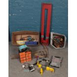 A quantity of of tools. Including sledge hammer, pickaxe, hammers, car clamp, etc.