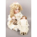 Three vintage bisque headed dolls. Including large CM Bergmann example, etc.