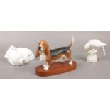 A collection of ceramic figure's. Beswick Bassett hound, Beswick Little Likeables 'Hide & Sleep'