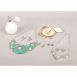 An assortment of sterling silver jewellery and accessories. To include a Stratton compact and