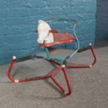 A vintage child's spring mounted bouncing horse. H: 52.5cm W: 62cm. Is rusting in parts, will need
