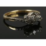An 18ct gold, platinum and diamond ring. Size P. 2.82g.