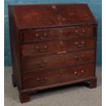 A Georgian mahogany four drawer bureau, with fitted interior. Height: 101cm, Width: 92cm, Depth: