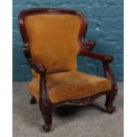 A child's carved mahogany armchair. Height: 55cm, Width: 40cm, Depth: 37cm. Back of chair not
