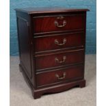 A large mahogany and red leather topped two drawer filing cabinet, with leather insert to the top.