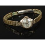 A ladies 9ct gold Uno manual wind wristwatch, with expanding stainless steel strap and 17 jewel