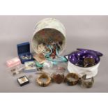 An assortment of costume jewellery. To include brooches, rings and bracelets etc.