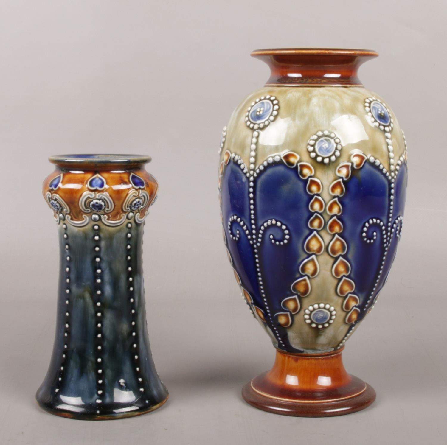 Two Royal Doulton stoneware vases, stamped 3309 and 6629 to the bases. Tallest example: 19.5cm.
