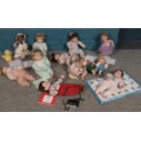 A collection of Ashton Drake porcelain dolls. 'Little Tornado', 'Enjoying a snack' 'Calling Grandma'