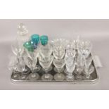A tray of assorted glassware. To include a cut glass decanter, etched and coloured examples etc (30)