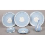 A collection of Wedgwood Jasperware. Christmas plates 1987, 1988, 1993, bud vase, trinket.