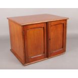 A vintage mahogany coin collectors cabinet. 26cm x 34.5cm x 27.5cm. Chip to front bottom edge. Hinge