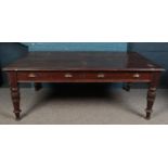 A large Victorian mahogany table, with two drawers to one side. Raised on tapering turned feet.