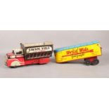 Two tin plate large vehicles. To include a c1950s large tin plate World Wide Freight wagon made by