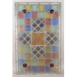 A large Victorian lead glazed stained glass panel, with decorative central pane surrounded by