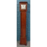 A miniature longcase clock in Art Deco style, with Smiths dial and quartz conversion movement.