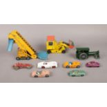 A box of assorted named die-cast vehicles. To include a Dinky Elevator Loader no 964, a Dinky Shovel