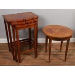 A nest of three mahogany tables along with a Italian style inlaid table.