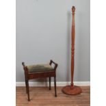 A Victorian CWS piano stool, with hinged seat raised on turned legs, together with a standard lamp
