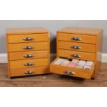 Two wooden storage drawers containing a large quantity of photograph slides.