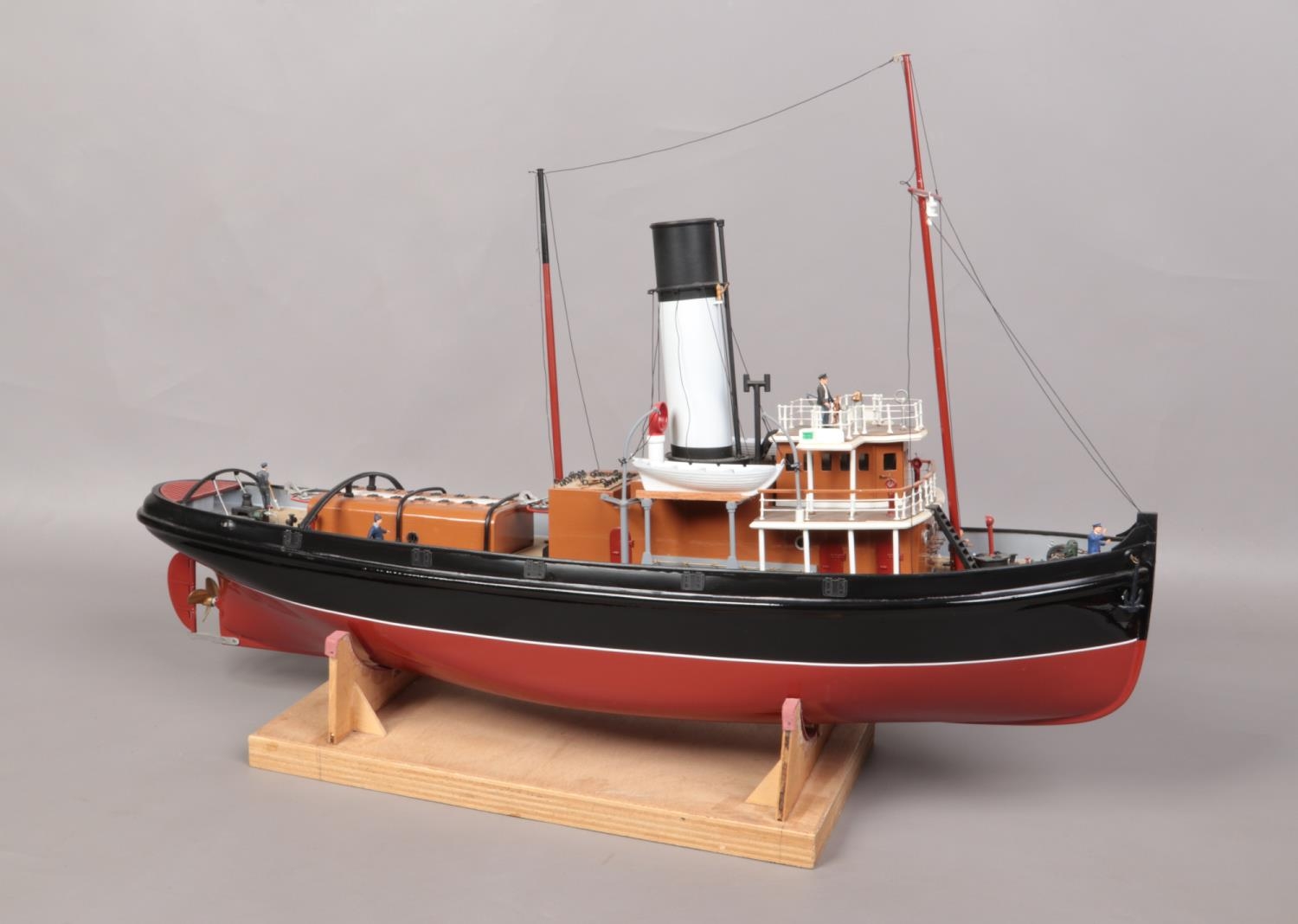 A remote control single funnel model boat on stand. L: 79cm W: 20cm. Will need electronics