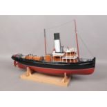 A remote control single funnel model boat on stand. L: 79cm W: 20cm. Will need electronics